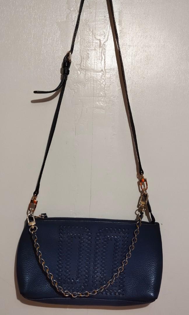 Daks 2 way bag (Category: Cross-body Bags) located in Taguig. Submitted by glaigee (Listing ID 1141467602, Image 2). Description: Daks 2 way bag. Can be kili bag or sling bag. Made of leather. Navy blue color. Well used. slightly negotiable.