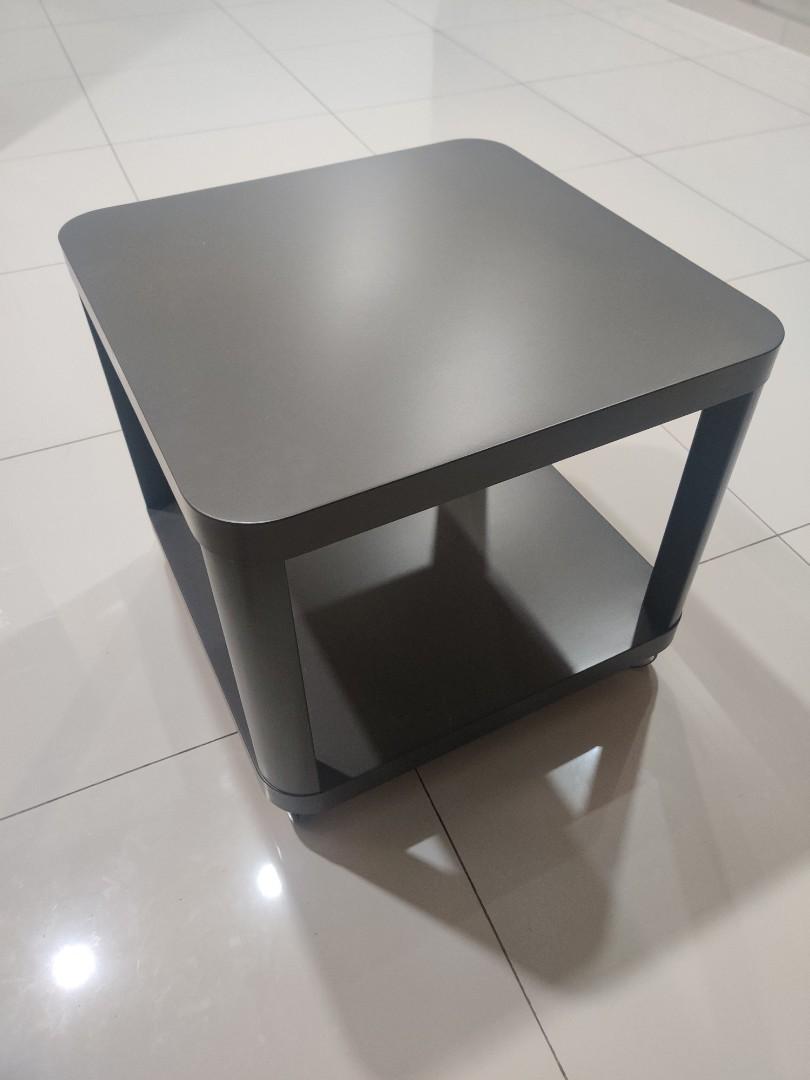 Tingby side outlet table on castors