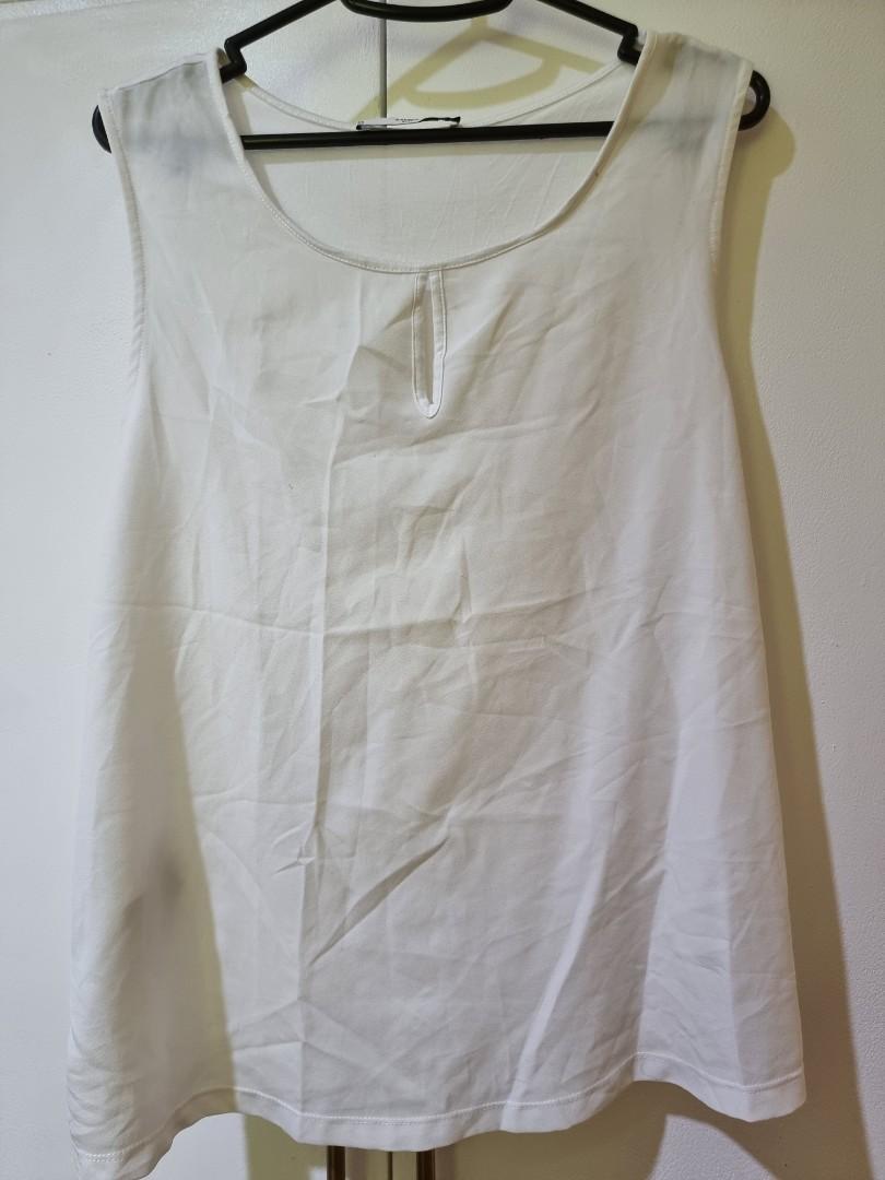 MNG Suit White Sleeveless Top (Category: Sleeveless) located in Manila. Submitted by decluttermystuff21 (Listing ID 1141717730, Image 1). Description: White Sleeveless Top Brand: Mango / MNG Suit Size: Medium Condition: Used in good condition, no flaws.