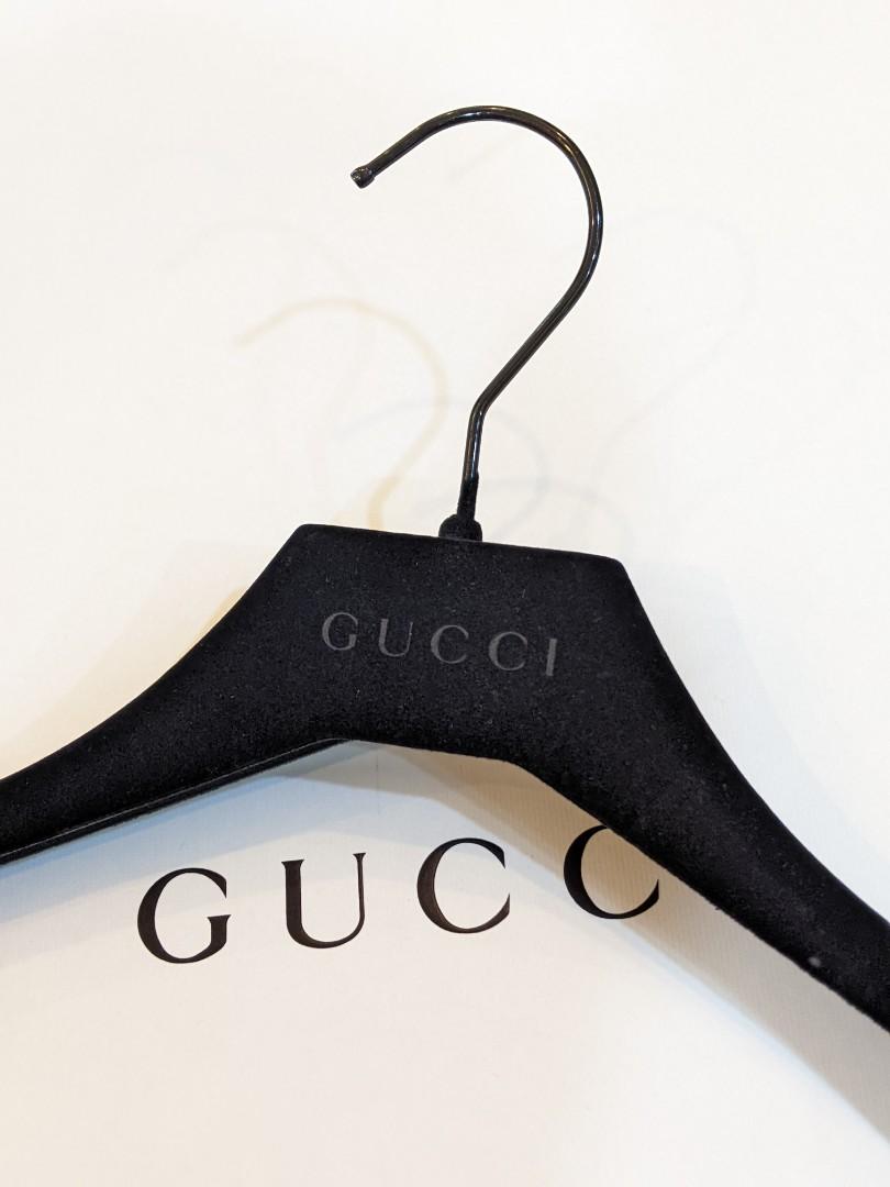 Authentic Gucci brown suede hanger with gold logo.