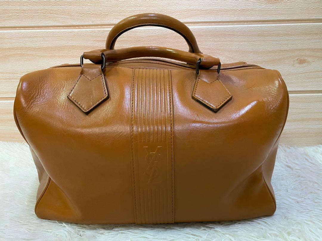 Authentic YSL Classic Bag (Category: Luxury Bags & Wallets) located in Cagayan de Oro. Submitted by riggstuffs (Listing ID 1072505092, Image 2). Description: Guaranteed Authentic YSL speedy type bag In camel brown colored vintage bag Iconic YSL logo is embossed at the front and back center part of the bag Exterior area is good,Some minor scuffs and edges has some signs of use but no cracks or holes at each corners. Interior compartment is spaciou
