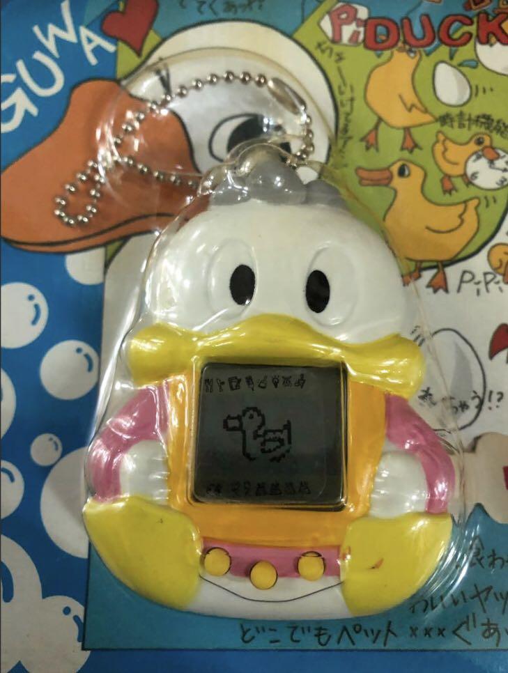 FREE TRACKED SHIPPING AND NEW AND UNUSED! Vintage Guwa Guappi Pi / Gyaoppi Duck - Tamagotchi electronic pet (Category: Vintage Collectibles) located in Singapore. Submitted by kobe78 (Listing ID 1142037759, Image 2). Description: Rare Gyaoppi Duck tamagotchi. New and in original packaging and with Japanese instruction manual. Perfect for tamagotchi collectors. Ships free with smartpac. .