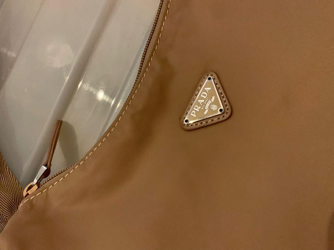 Vintage Prada Baguette Bag (Category: Luxury Bags & Wallets) located in Mandaluyong City. Submitted by amvvg (Listing ID 1142011742, Image 3). Description: Vintage Prada Baguette Bag Lampo zipper NGA - Please self authenticate before purchasing All pictures posted Issue: with hole inside - no code (see last pic) Selling for only 4,500 Rfs: Decluttering For pickup in Mandaluyong area.