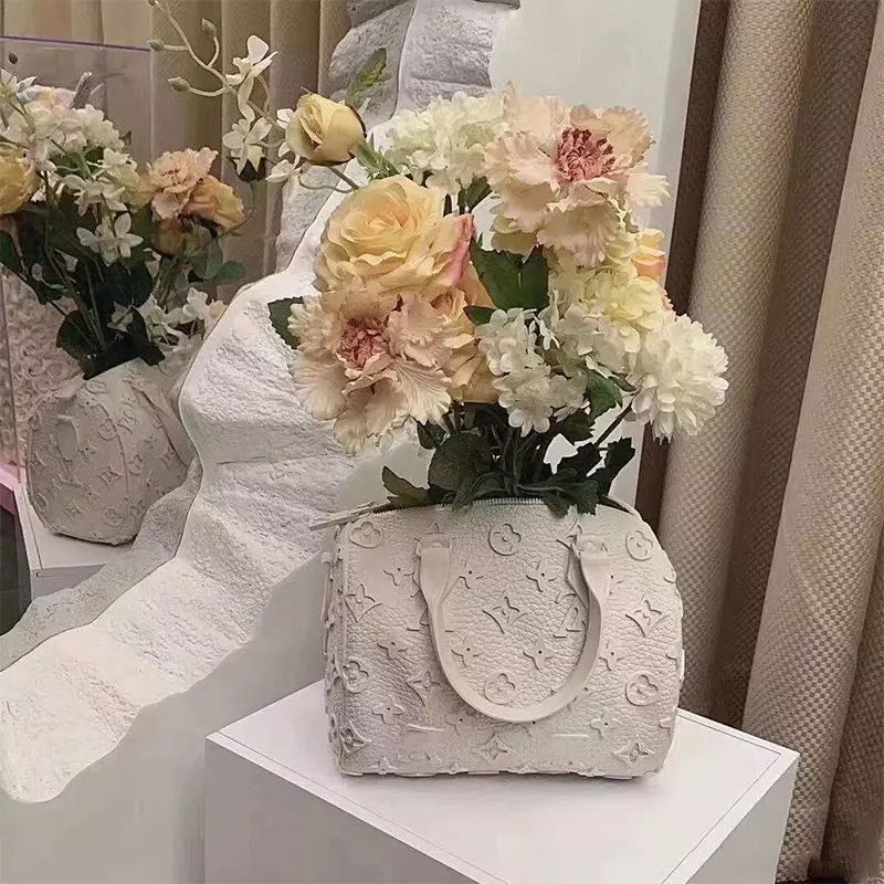LV branded bag vase