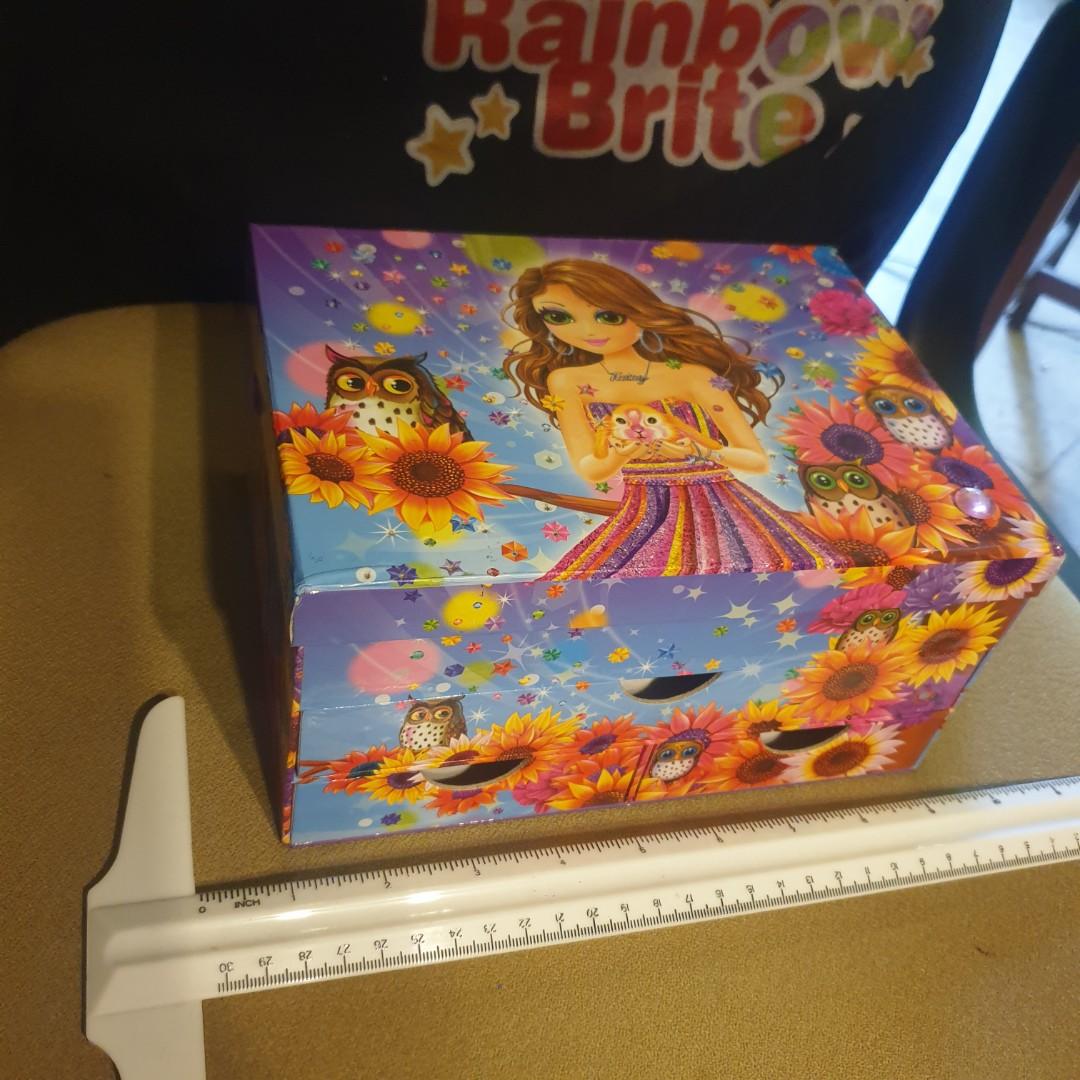 Lisa Frank Light-Up Stationery Box (Category: Stationery & School Supplies) located in Manila. Submitted by RetroRainbowChaser (Listing ID 1142390085, Image 2). Description: Selling rare and hard to find Lisa Frank stationery light-up box. It's got the character Tatey Bug on almost all sides. It has a small mirror inside. :) See ruler in pics as size reference Made of durable, thick carboard, the item is sturdy. It has 3 drawers aside from the to