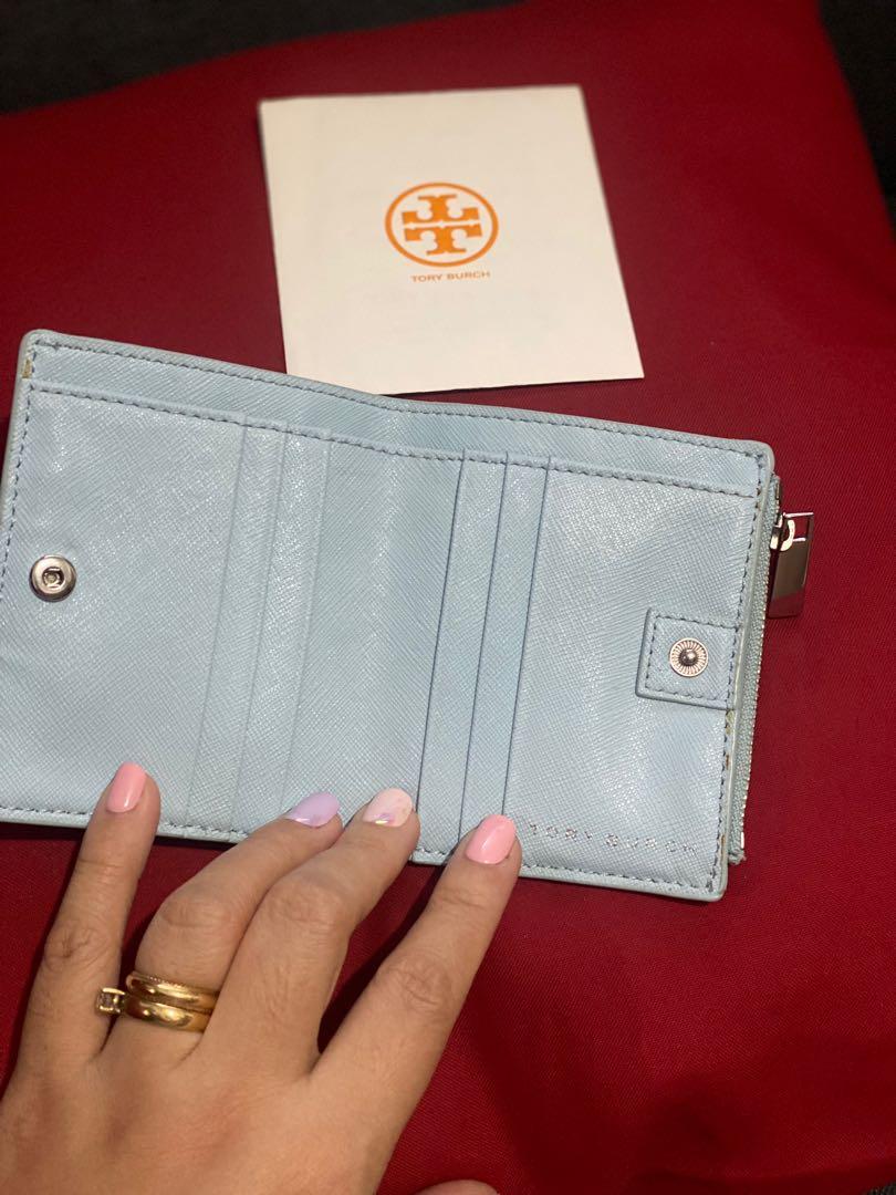 Tory Burch Emerson Mini Wallet (Category: Luxury Bags & Wallets) located in Paranaque City. Submitted by sillybella (Listing ID 1142545841, Image 3). Description: Tory Burch Emerson Mini Wallet 2020 Summer Edition C: Clear Blue - Preloved - Excellent Condition looks new - See attached photos for details Complete with care cards 100% Authentic | Legit Money back Guaranteed Saffiano leather Pin snap closure 6 interior credit card slots, 2 bill pock