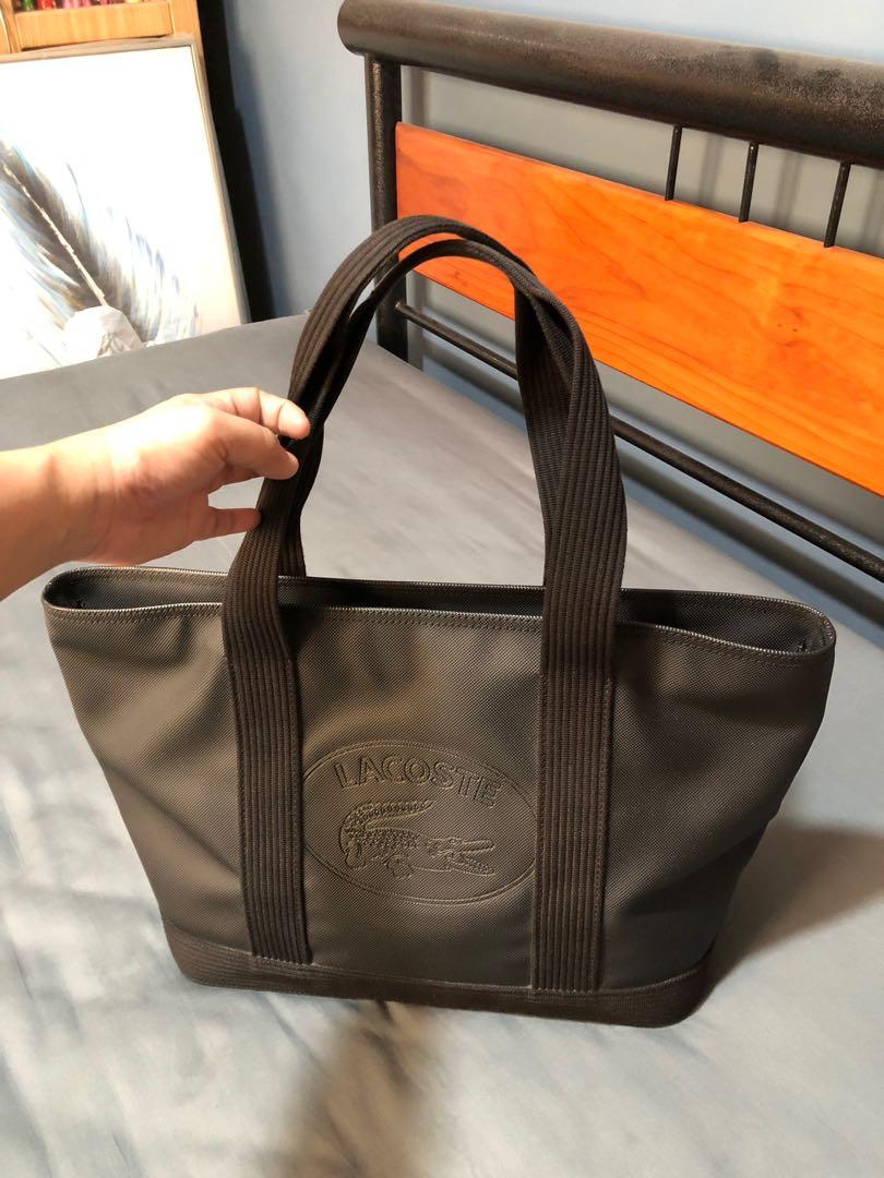 Authentic preloved Lacoste Black Shopping Bag - Medium (Category: Luxury Bags & Wallets) located in Quezon City. Submitted by lots2love (Listing ID 1146363199, Image 2). Description: Authentic preloved Lacoste Black Shopping Bag - Medium - Material: PVC - Purchased at P6,950 from Lacoste store in Trinoma (with tag and receipt); comes with dustbag - A heavy duty bag that is very durable, long-lasting, very spacious, perfect for working women. It i