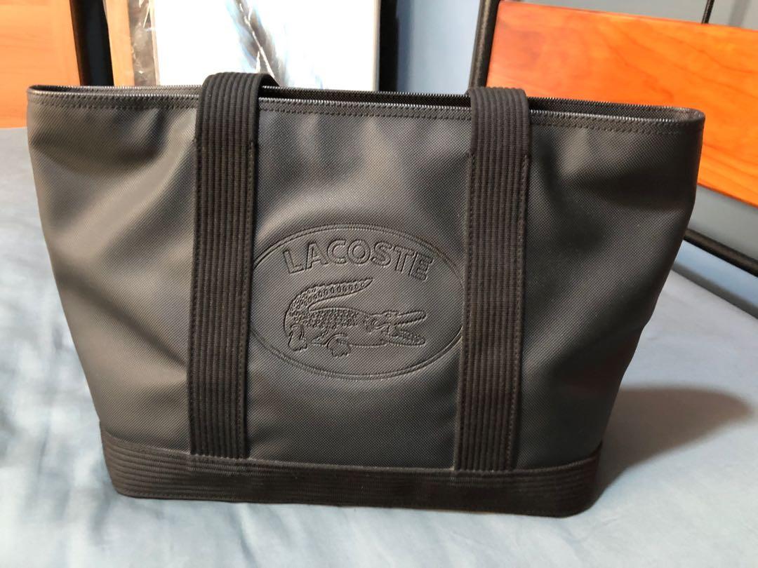 Authentic preloved Lacoste Black Shopping Bag - Medium (Category: Luxury Bags & Wallets) located in Quezon City. Submitted by lots2love (Listing ID 1146363199, Image 1). Description: Authentic preloved Lacoste Black Shopping Bag - Medium - Material: PVC - Purchased at P6,950 from Lacoste store in Trinoma (with tag and receipt); comes with dustbag - A heavy duty bag that is very durable, long-lasting, very spacious, perfect for working women. It i