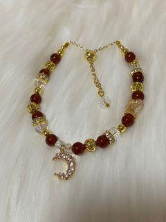 Brown crystal bracelet with crescent on sales at $15