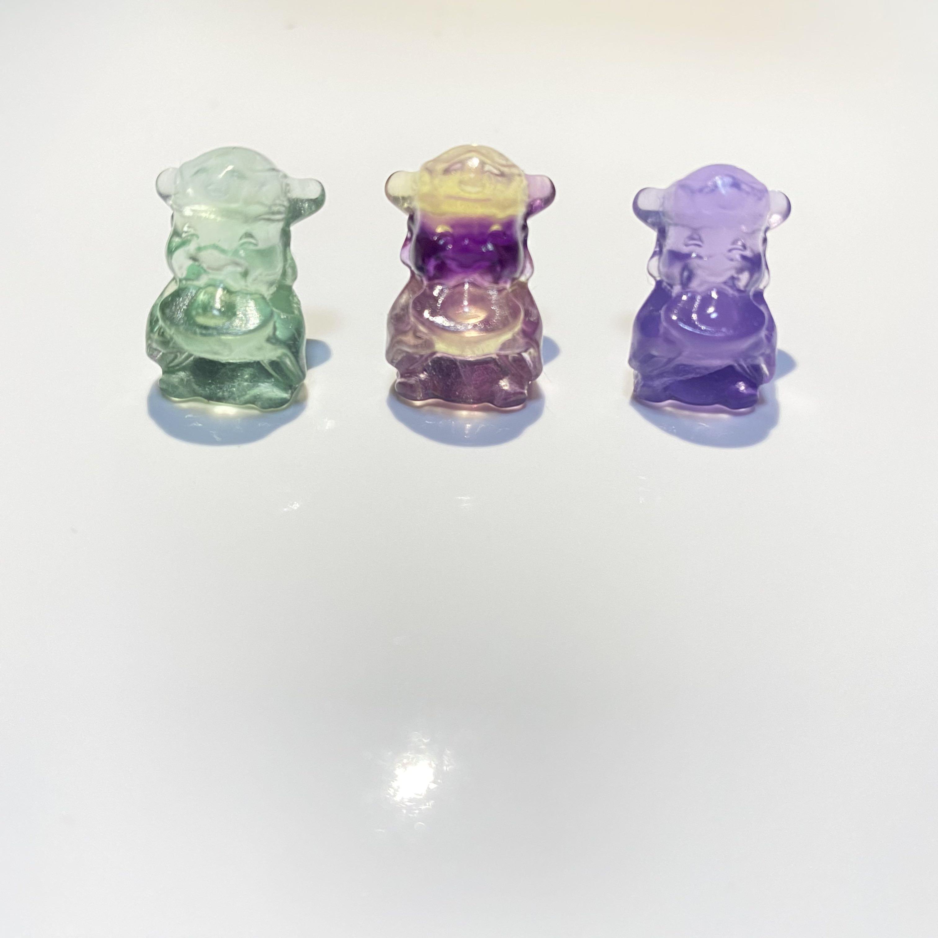 Fluorite display characters (Category: Precious Stones) located in Singapore. Submitted by jvgsw05 (Listing ID 1112415421, Image 2). Description: Fluorite is multi-colored mineral known for its powerful energetic healing properties and mesmerising physical beauty. The fluorite stone received its name from the fluorescent luminance that it emits when held under certain angles of UV light, giving it a magical glowing appearance. This enigmatic crys