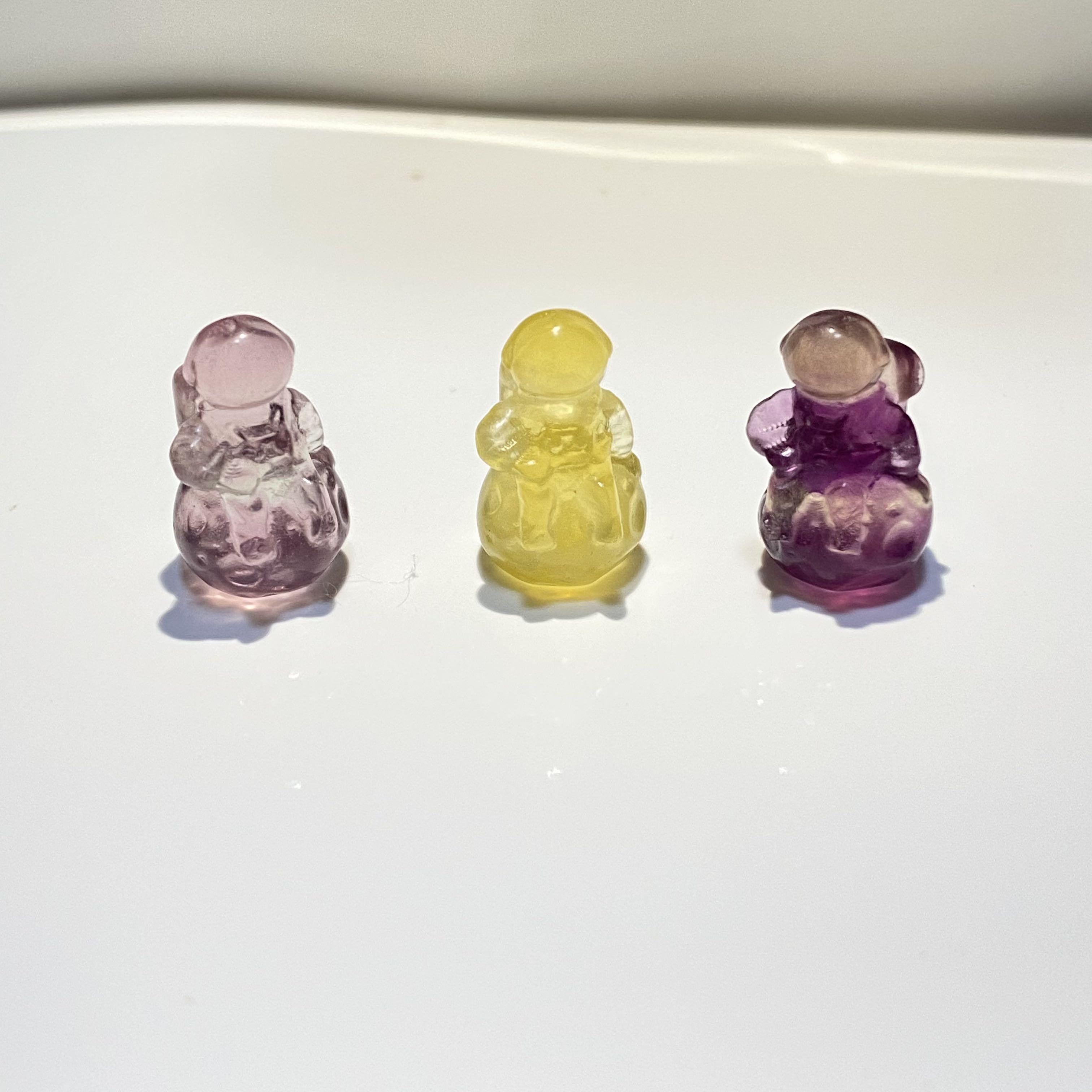 Fluorite display characters (Category: Precious Stones) located in Singapore. Submitted by jvgsw05 (Listing ID 1112415421, Image 3). Description: Fluorite is multi-colored mineral known for its powerful energetic healing properties and mesmerising physical beauty. The fluorite stone received its name from the fluorescent luminance that it emits when held under certain angles of UV light, giving it a magical glowing appearance. This enigmatic crys