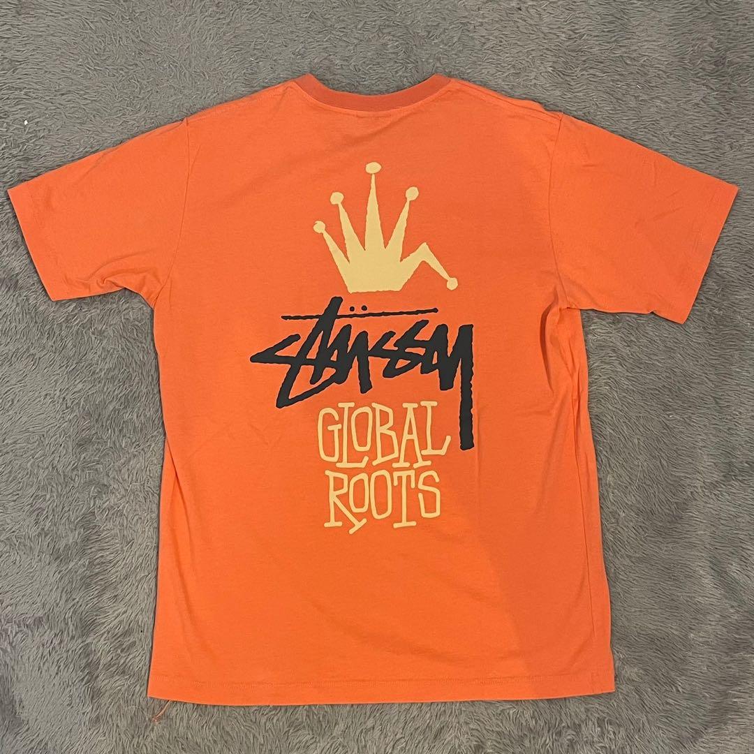 Kaos stussy global roots orange tshirt 