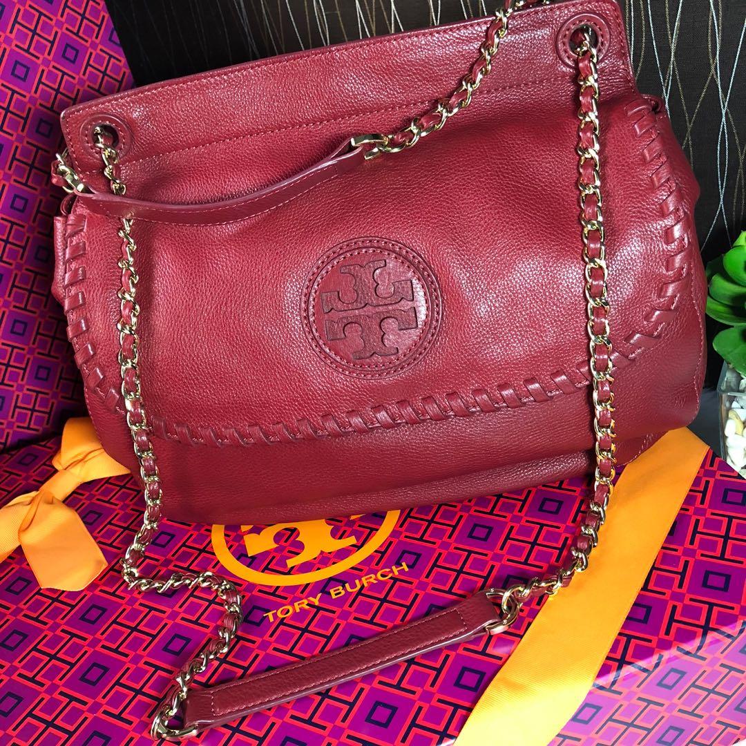 Tory Burch Marion Saddle Bag (Category: Luxury Bags & Wallets) located in Quezon City. Submitted by ABI.LuxeCloset (Listing ID 1146506171, Image 2). Description: BRAND: Tory Burch SIZE: 11H x 14”W x 4 1/2”D Color: Rouge Red MATERIAL: Pebbled leather with tonal topstitching and golden hardware. ✖️Original Price: Php 26,250 Tory Burch is a luxury lifestyle brand defined by classic American sportswear with an eclectic sensibility. It embodies the pe