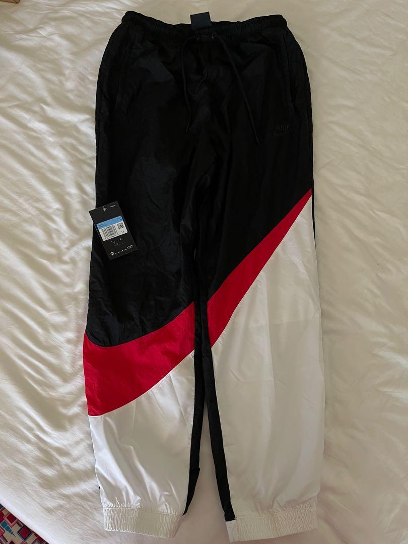 kith nike big swoosh pants
