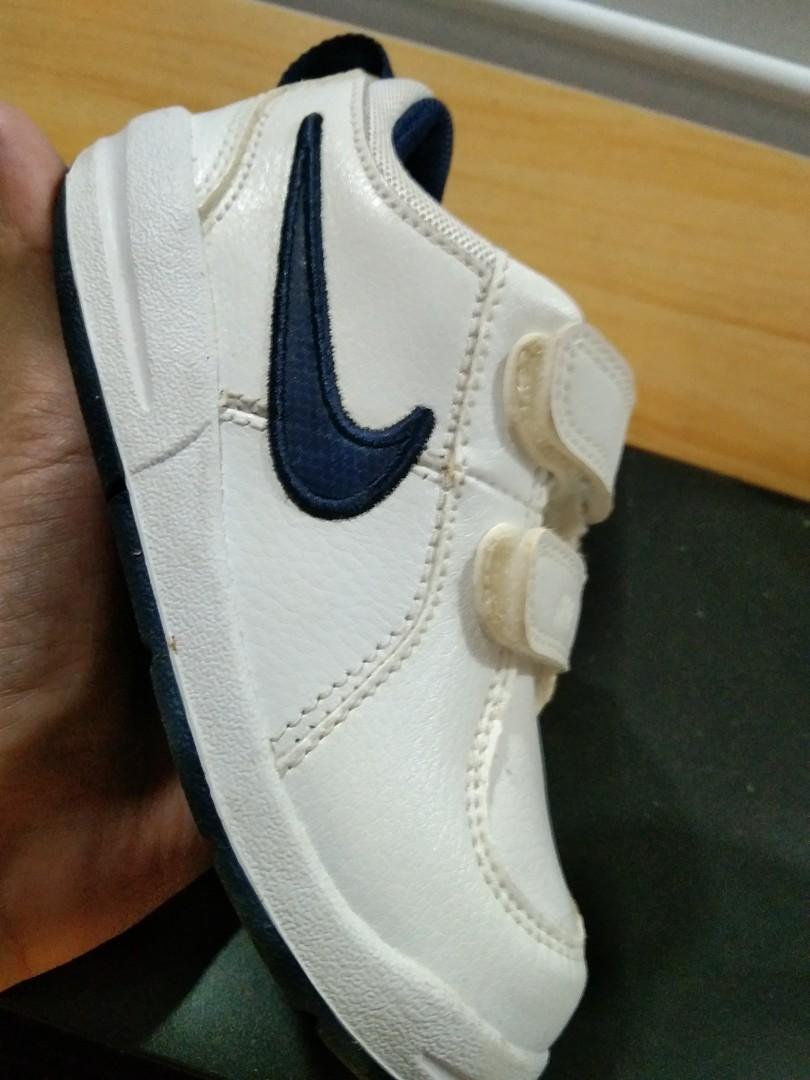 Nike INF Pico 4 (Toddler Shoes) (Category: Sneakers) located in Bulacan. Submitted by ehsryll (Listing ID 1148324821, Image 2). Description: Nike INF PICO 4 (toodler) shoes White/Navy Blue Size 7.5 Bought in Africa last 2019 for 499.95 african dollar or around 1.8k in philippine peso. Never used dahil naabutan ng lockdown at hindi nakauwi ng pinas. Nagkaroon lang ng discoloration dahil sa storage..