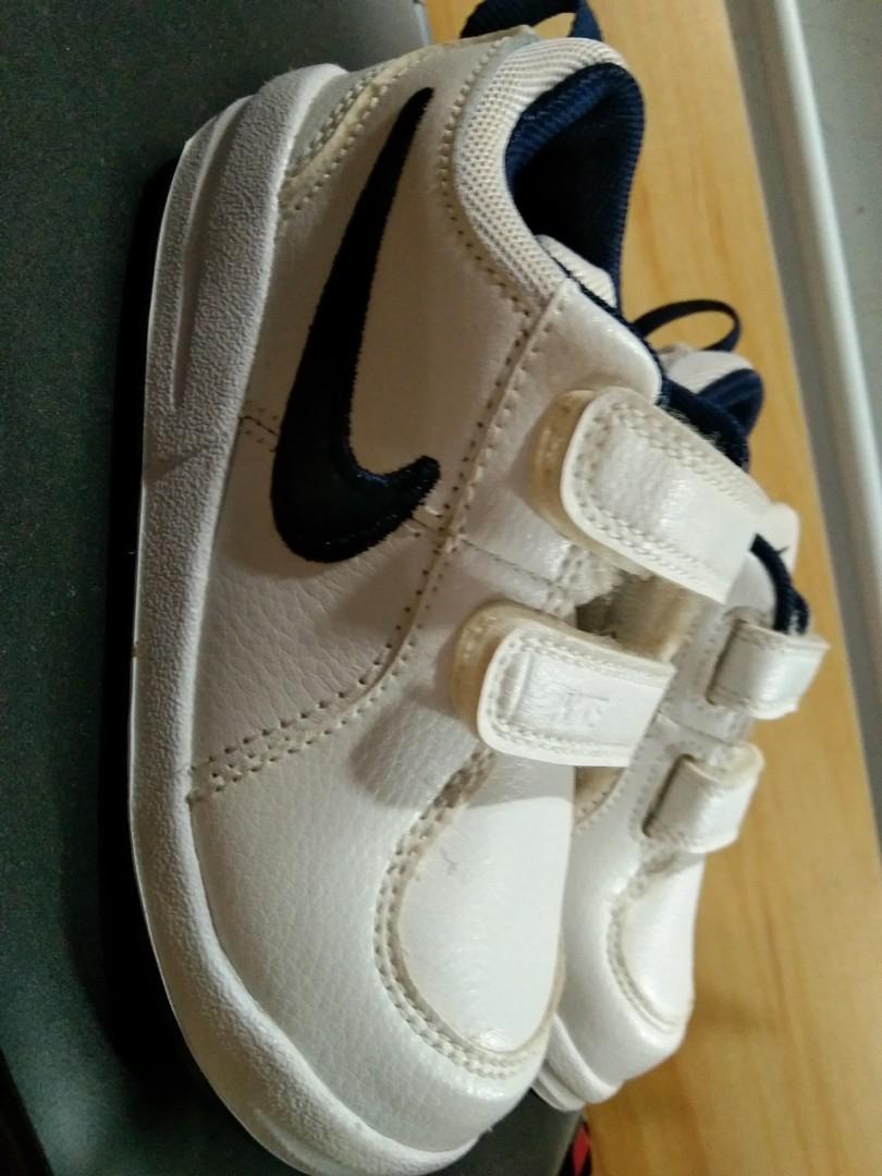 Nike INF Pico 4 (Toddler Shoes) (Category: Sneakers) located in Bulacan. Submitted by ehsryll (Listing ID 1148324821, Image 1). Description: Nike INF PICO 4 (toodler) shoes White/Navy Blue Size 7.5 Bought in Africa last 2019 for 499.95 african dollar or around 1.8k in philippine peso. Never used dahil naabutan ng lockdown at hindi nakauwi ng pinas. Nagkaroon lang ng discoloration dahil sa storage..