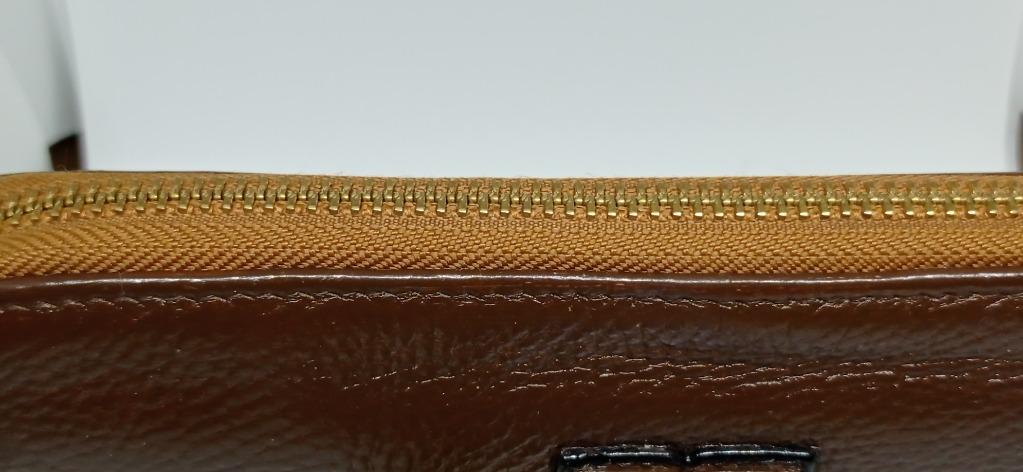 Tory Burch leather wallet (Category: Luxury Bags & Wallets) located in Pasig City. Submitted by goodmom23 (Listing ID 1148541584, Image 3). Description: Pre-loved authentic Tory Burch soft leather long wallet bought in US outlet store. This was repainted, zipper pullers tarnishing but still in great usable condition. The wallet has 8 card slots, 2 paper bills compartments and one zippered coin compartment..