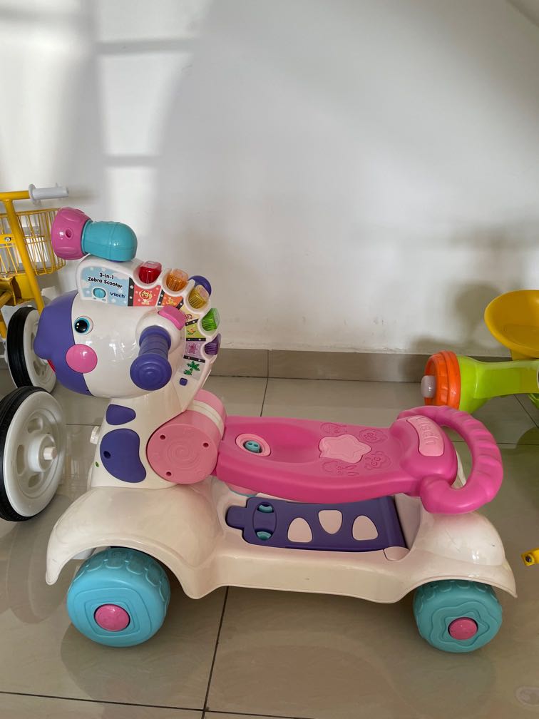 Vtech in zebra scooter