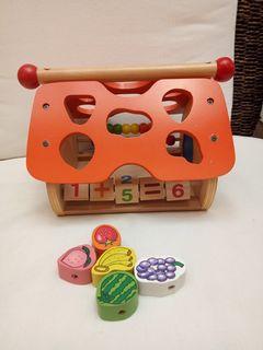 Wooden Playhouse with fruit shape sorter, clock and math feature