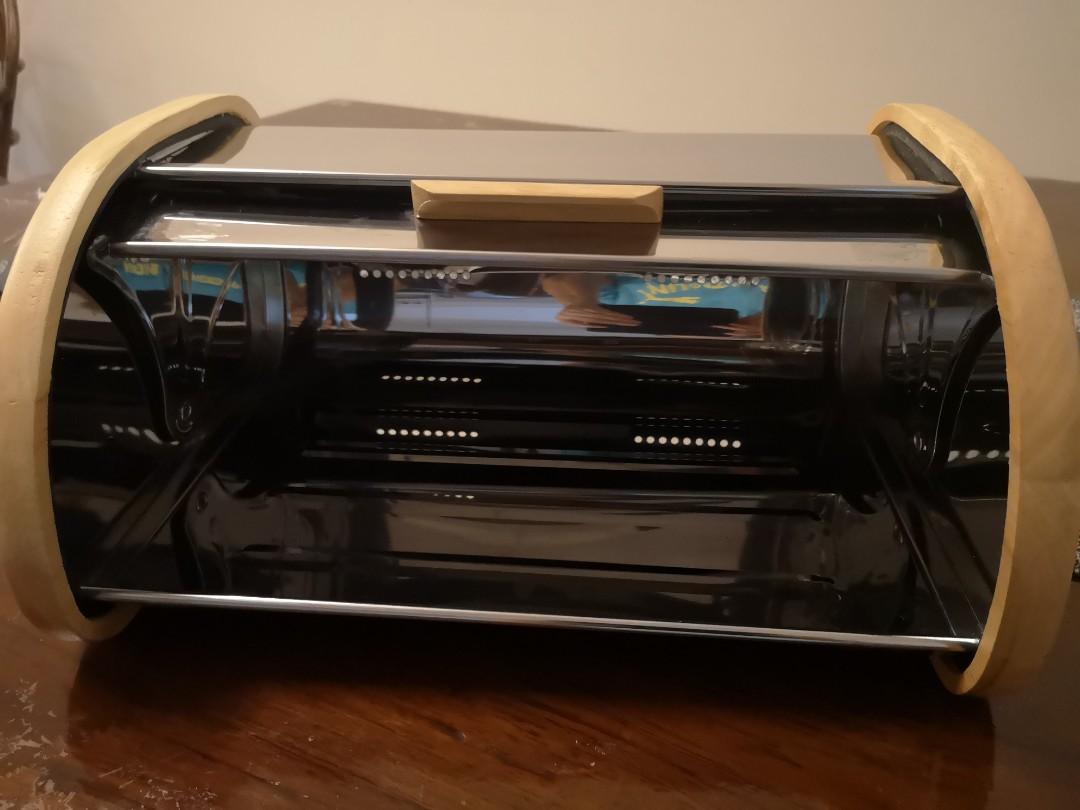 Bread keeper (Category: Breadmakers) located in Shah Alam. Submitted by pung99 (Listing ID 1148785928, Image 2). Description: A forgotten piece from the storeroom. Never been used. Size 34cm(width)x 24cm(depth)x16cm(height). A premium solid wood and stainless steel piece. It will look elegant on the dining table. There are cellophane tape mark at the bottom(Refer to last photo) which can be removed using oil but I am too lazy doing it. Will send 