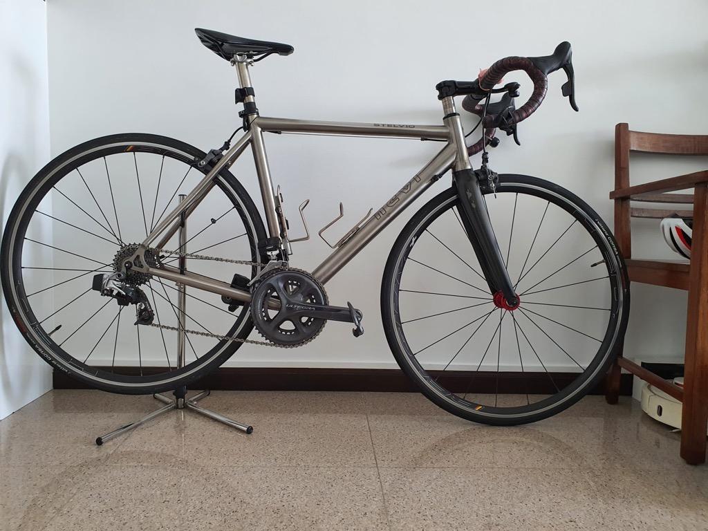 For Sale : Italy handmade Titanium road bike (Category: Parts & Accessories) located in Singapore. Submitted by tzemeng (Listing ID 1148721804, Image 1). Description: Titanium road bike Brand : Nevi Model : Stelvio Material : Ti 3AL / 2.5V Size : rider is 180cm tall Thomson carbon handlebar Thomson stem Titanium seat post Saddle (optional) Sram eTap Red 11-speed with New batteries (brake levers, front and rear derailleurs) Shimano Ultegra rim bra