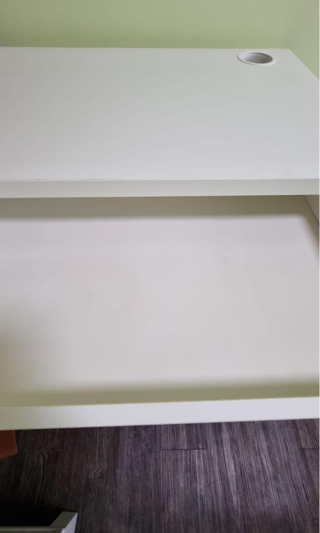 IKEA computer table (Category: Tables & Sets) located in Singapore. Submitted by eugene.khoo.334 (Listing ID 1148788013, Image 3). Description: Item was still new and drawer is still in good condition and abit tear off on the pictures or else whole table is as good as new .