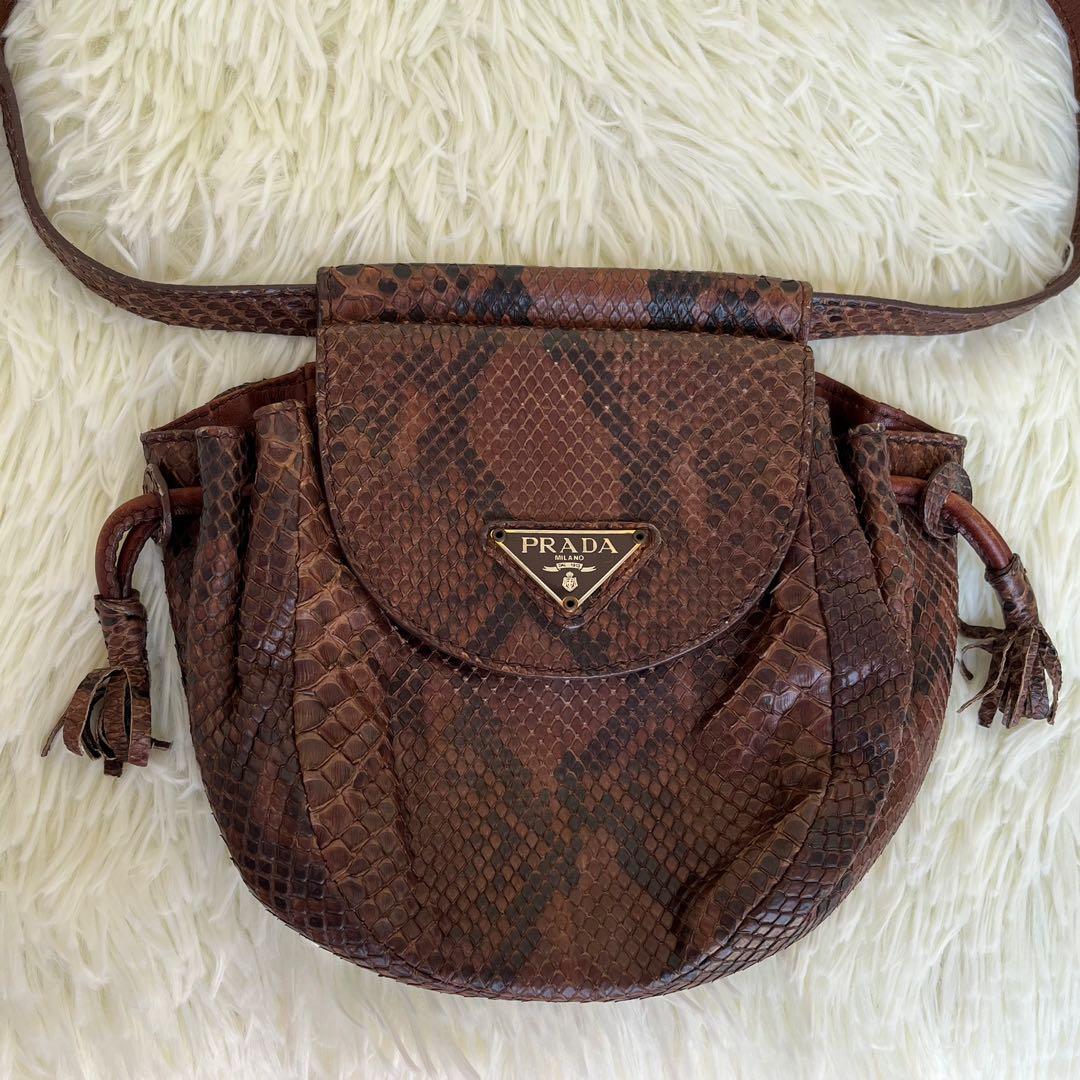 Prada Mini Python Beltbag (Category: Luxury Bags & Wallets) located in Las Pinas. Submitted by Le.Pattie.Luxe (Listing ID 1148638621, Image 2). Description: Authentic Prada Mini Python Belt Bag Super cute in person💕 ▪️Can fit iPhone15 Pro Max. ▪️Excellent used condition ▪️No major flaws to disclose ▪️Can be worn belt/body/shoulder bag .