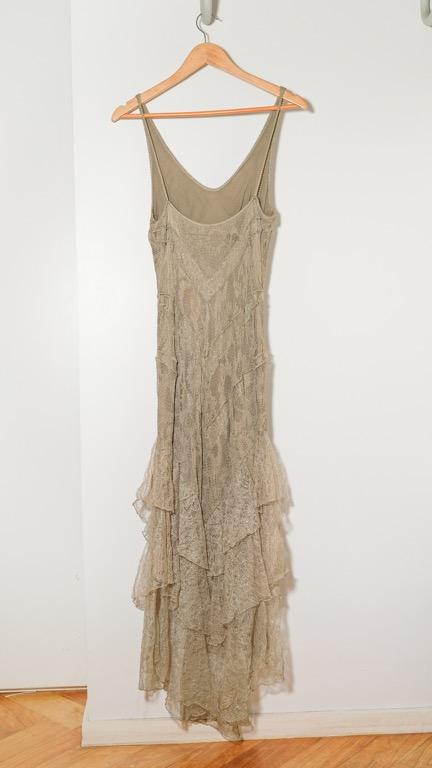 Olive and gold evening dress (Category: Evening dresses & gowns) located in Makati City. Submitted by patchdeclutters (Listing ID 1148904472, Image 2). Description: Color: Light Olive Size: Approx. XS Material: Fully lined with a stretchy olive material, Stretchy lace outer material with gold detailing Measurements: Length from top of strap to longest edge: 56 in Waist: 26 in unstretched.