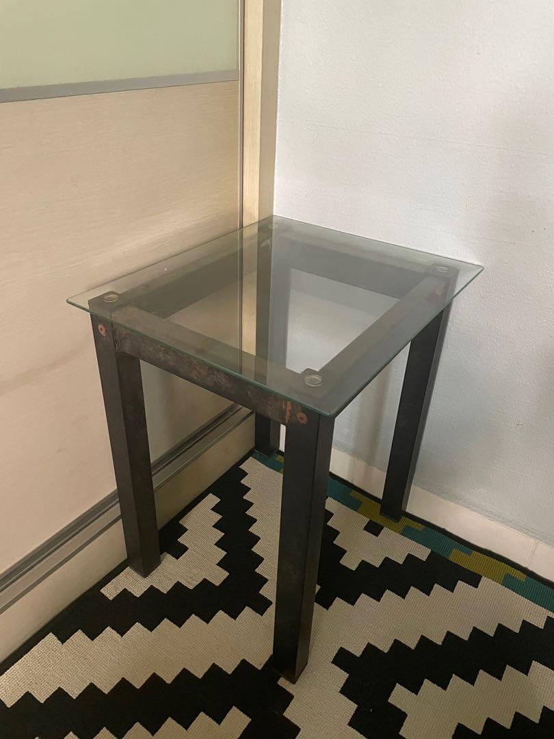 Bedside table (Category: Tables & Sets) located in Singapore. Submitted by ogyayoko (Listing ID 1149290995, Image 1). Description: Bedside table with glass top and metal legs. Glass top condition 10/10, no cracks or chips. Metal leg rusty look. Good if u want to refurbish. L44 W37 H50 cm.