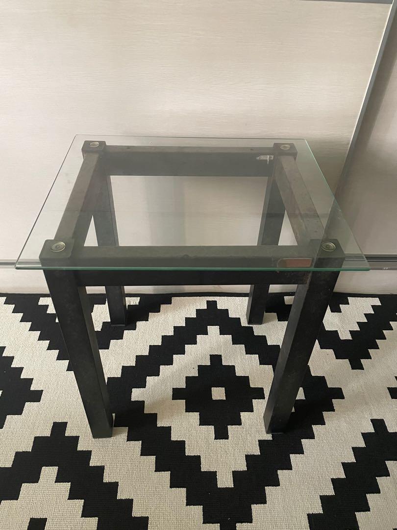Bedside table (Category: Tables & Sets) located in Singapore. Submitted by ogyayoko (Listing ID 1149290995, Image 2). Description: Bedside table with glass top and metal legs. Glass top condition 10/10, no cracks or chips. Metal leg rusty look. Good if u want to refurbish. L44 W37 H50 cm.