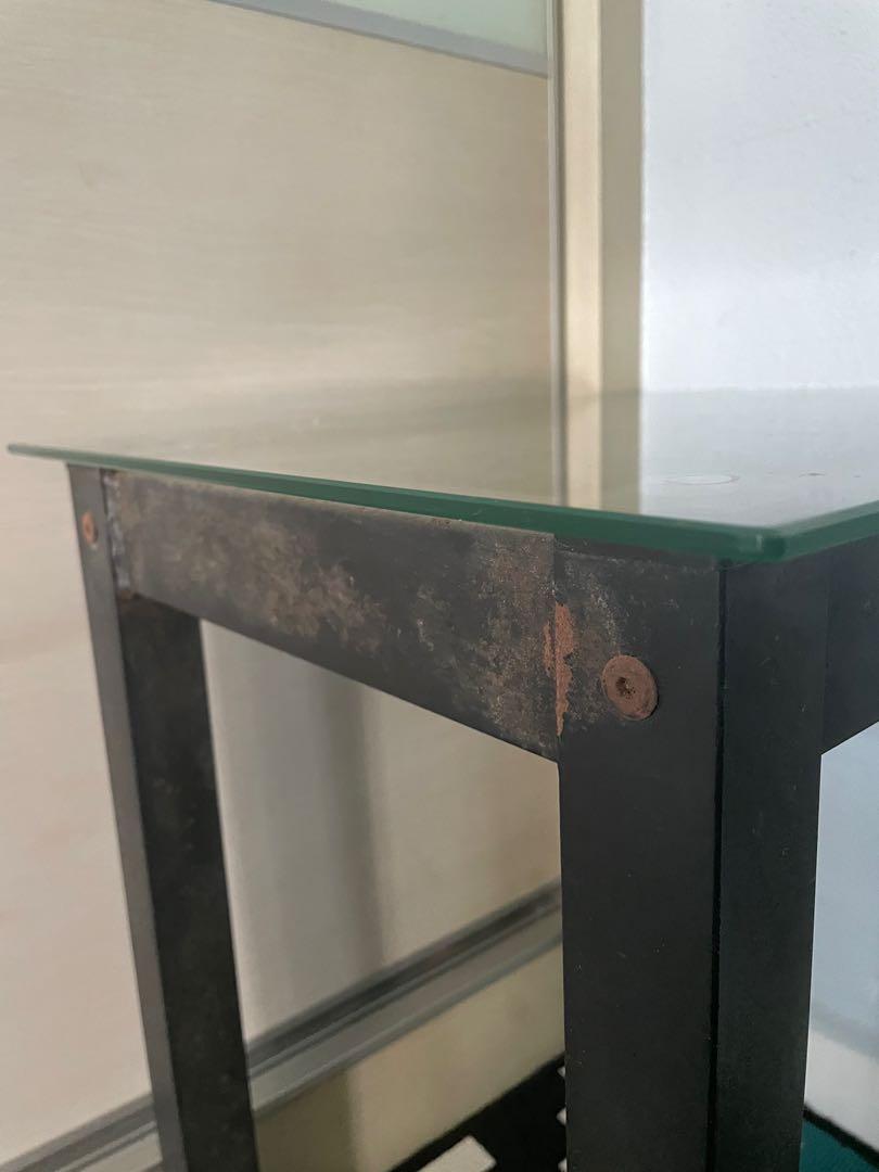 Bedside table (Category: Tables & Sets) located in Singapore. Submitted by ogyayoko (Listing ID 1149290995, Image 3). Description: Bedside table with glass top and metal legs. Glass top condition 10/10, no cracks or chips. Metal leg rusty look. Good if u want to refurbish. L44 W37 H50 cm.