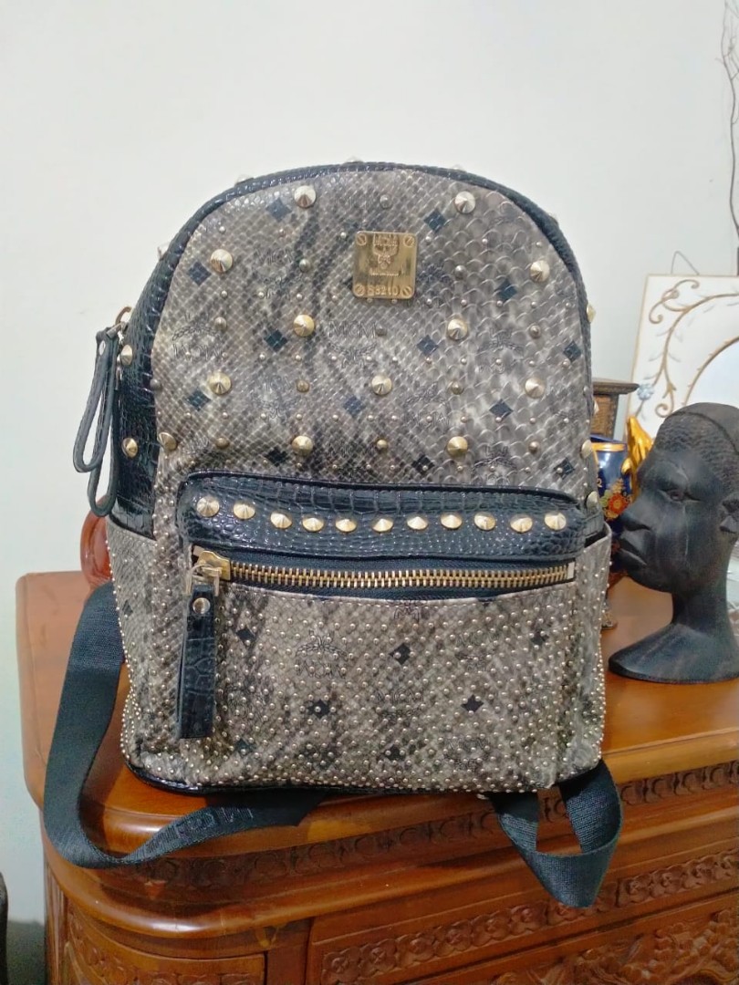 Mcm snakeskin backpack discount