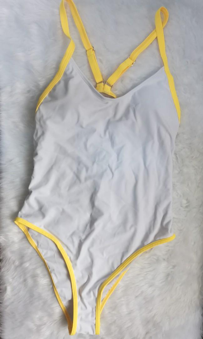 White swimsuit (Category: Bikinis & Swimsuits) located in Marikina City. Submitted by declutterkpcloset (Listing ID 1149635953, Image 1). Description: size is medium.