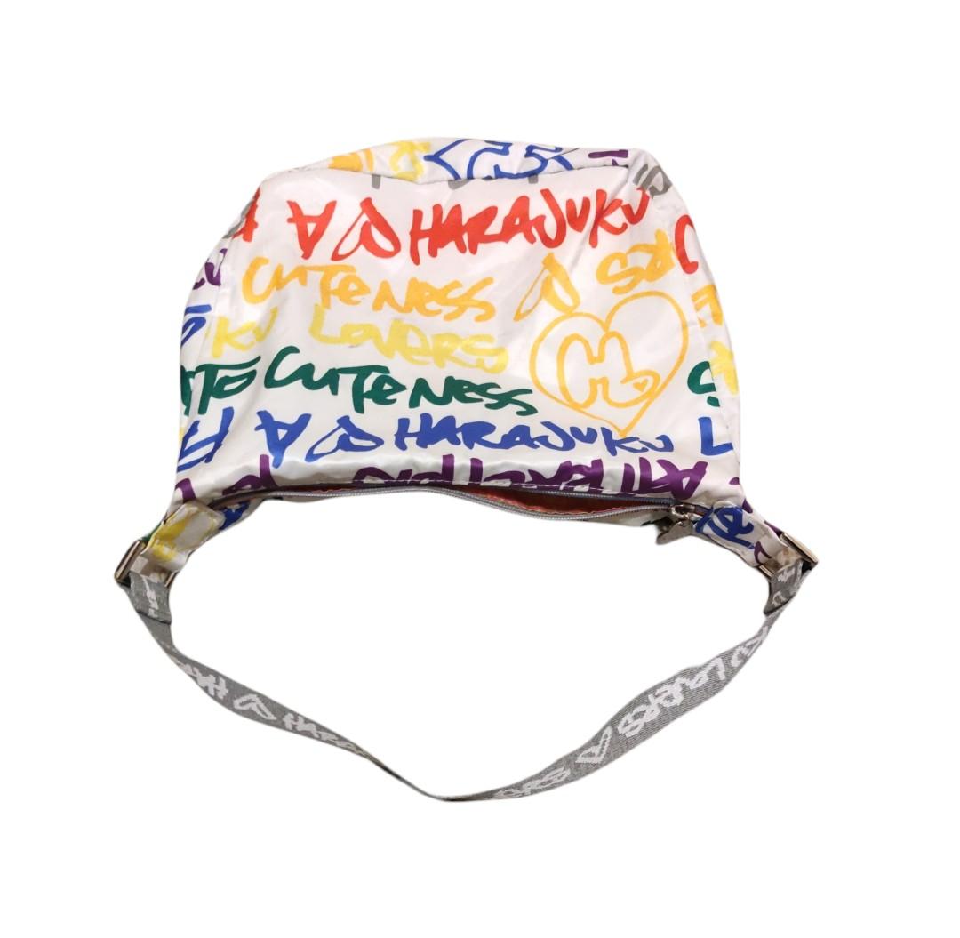 Auth Harajuku Lovers Multicolored Hobo Bag (Category: Shoulder Bags) located in Angeles City. Submitted by schinina (Listing ID 1149951847, Image 1). Description: One of my faves! perfect bag if you are into bright or colored outfits ❤️ With Few unnoticeable stains but item still looks new. Zippers are working! Strap is not adjustable. Material is nylon and very spacious inside Length: 11 inches Height: 9 inches (strap not included).
