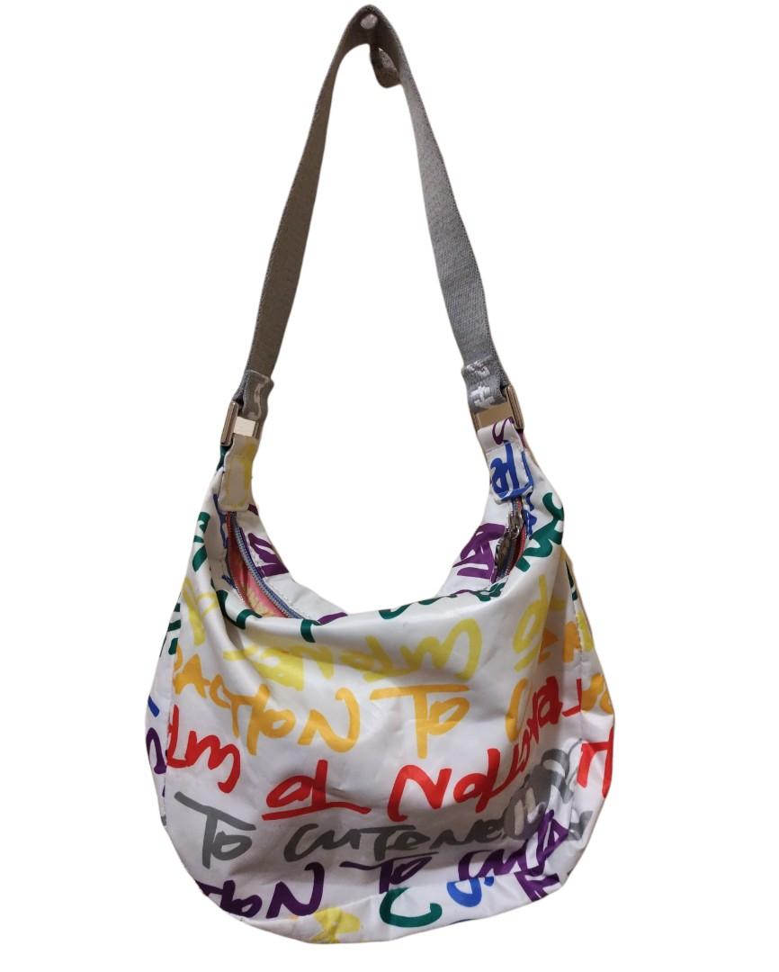 Auth Harajuku Lovers Multicolored Hobo Bag (Category: Shoulder Bags) located in Angeles City. Submitted by schinina (Listing ID 1149951847, Image 2). Description: One of my faves! perfect bag if you are into bright or colored outfits ❤️ With Few unnoticeable stains but item still looks new. Zippers are working! Strap is not adjustable. Material is nylon and very spacious inside Length: 11 inches Height: 9 inches (strap not included).