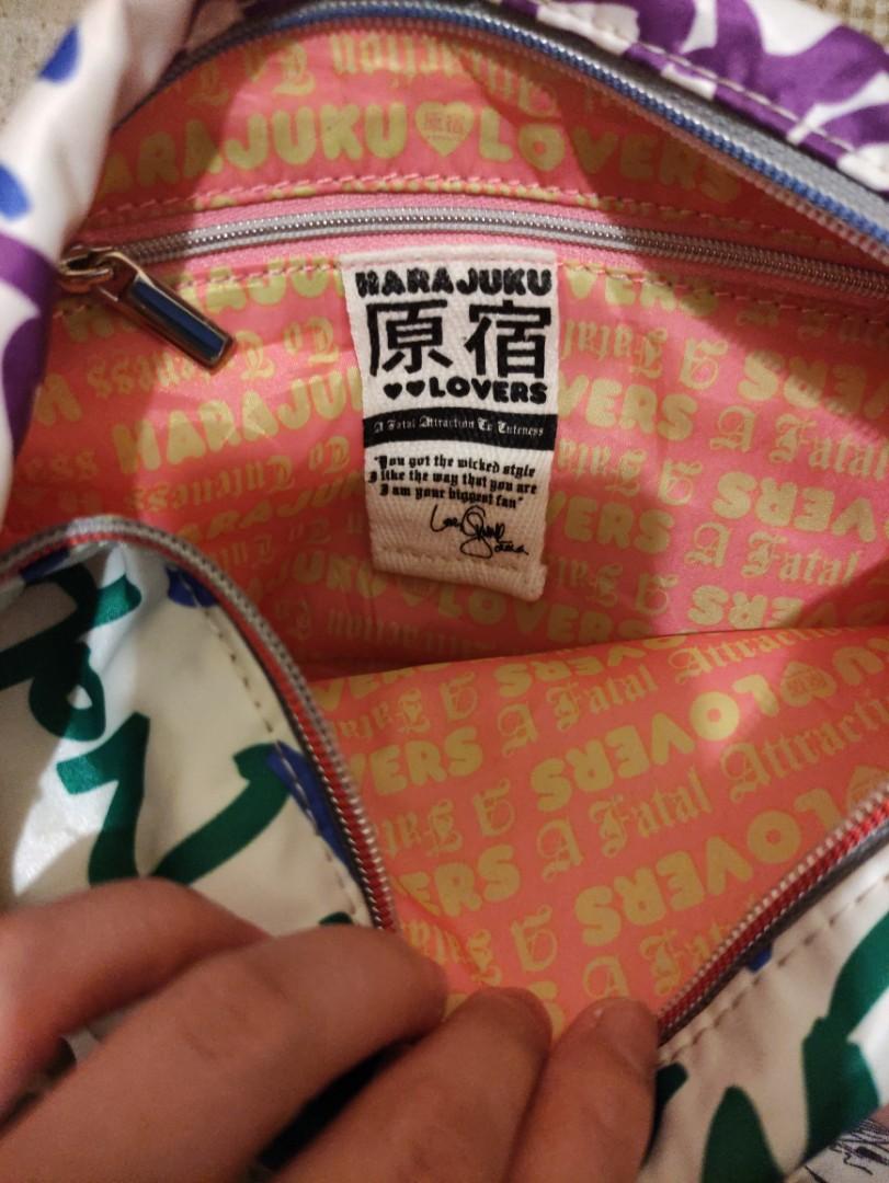 Auth Harajuku Lovers Multicolored Hobo Bag (Category: Shoulder Bags) located in Angeles City. Submitted by schinina (Listing ID 1149951847, Image 3). Description: One of my faves! perfect bag if you are into bright or colored outfits ❤️ With Few unnoticeable stains but item still looks new. Zippers are working! Strap is not adjustable. Material is nylon and very spacious inside Length: 11 inches Height: 9 inches (strap not included).