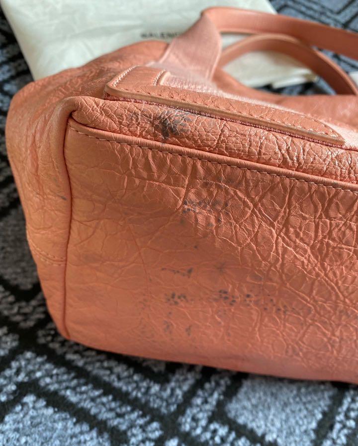 Balenciaga bag (Category: Luxury Bags & Wallets) located in Quezon City. Submitted by luxury.xy (Listing ID 1149922139, Image 3). Description: 100% authentic Balenciaga hand bag Comes with dust bag and cards Color is soft peach made of soft and durable leather Barely used but please note color transfer/stain the the bottom Note minor rubs on corners and dirt No tears/rips See photos for details Selling low! MOP: BDO/BPI/Paypal/Gcash Sf c/o buyer 