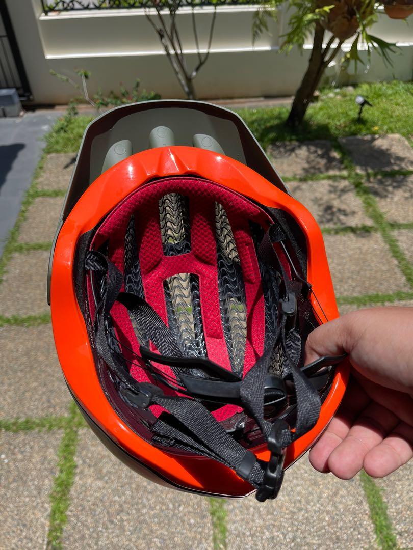 Olive and orange bike helmet shop
