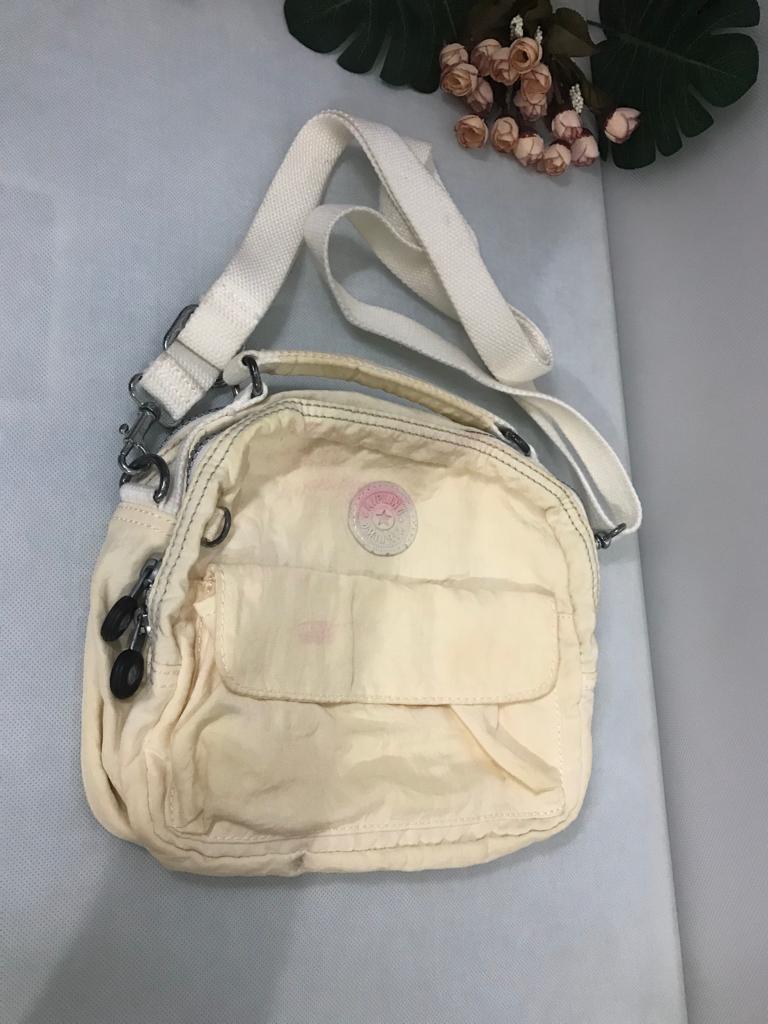 Kipling sling backpack hotsell
