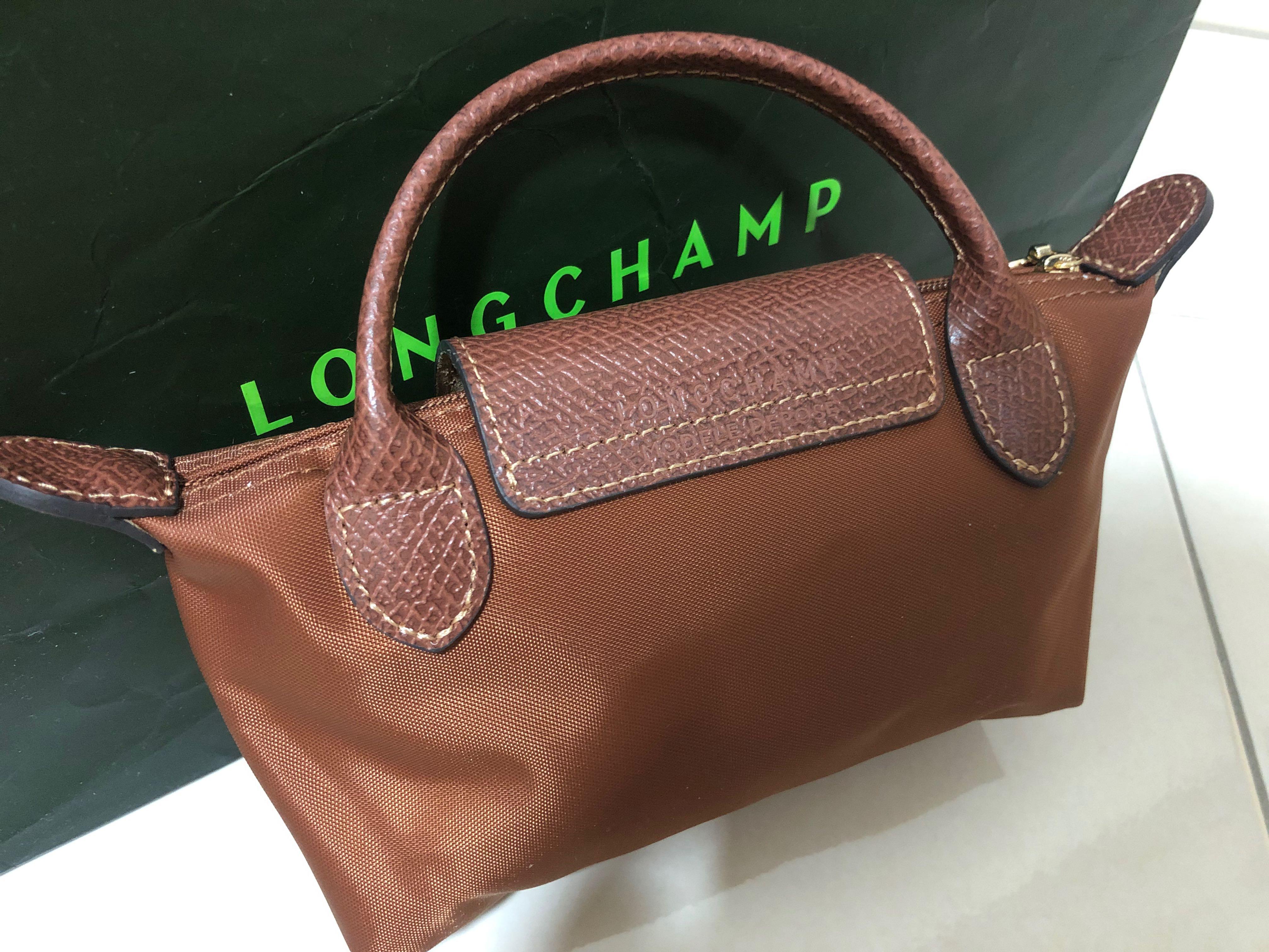 Longchamp Pouch With Handle In Cognac, Luxury, Bags & Wallets on Carousell