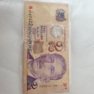 $2 note with red marks