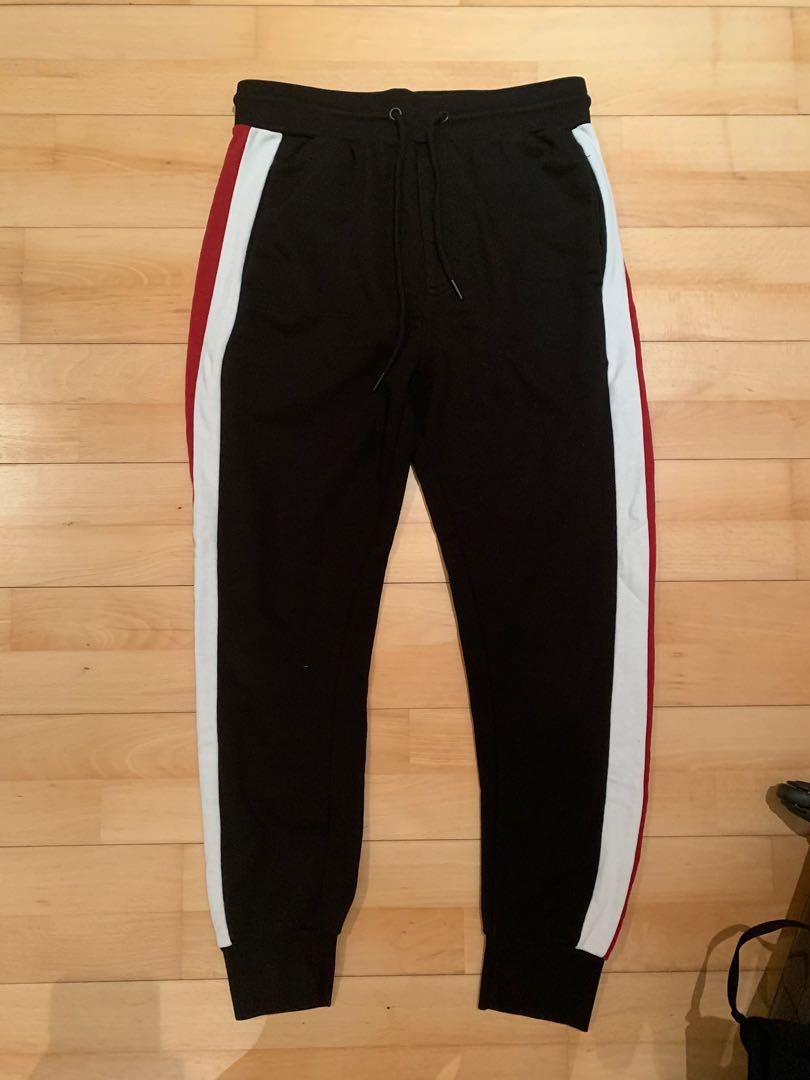 Red black top and white joggers