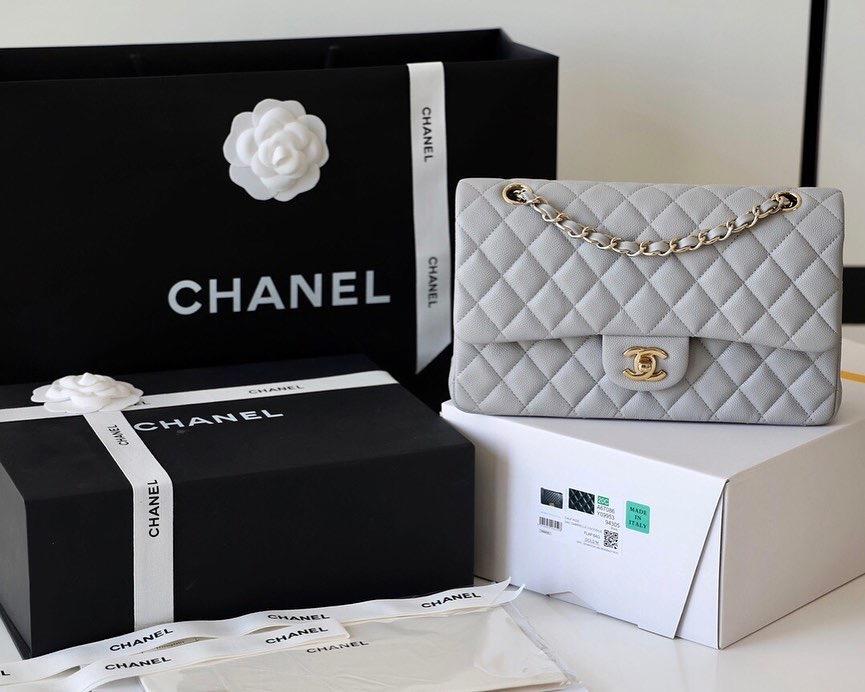 Chanel Flap Bag – Grey - Bag in excellent condition like new with the original box (Category: Bags & Wallets) located in Ottawa. Submitted by sarahlouiseboutique (Listing ID 1150322840, Image 3). Description: Grey color HARD to find This beautiful Chanel Classic - Maxi is crafted in luxurious Caviar Leather and comes in Grey. Inspired by Coco Chanel’s iconic 2.55 design, Karl Lagerfeld developed the design further to host the interlocking CC hard