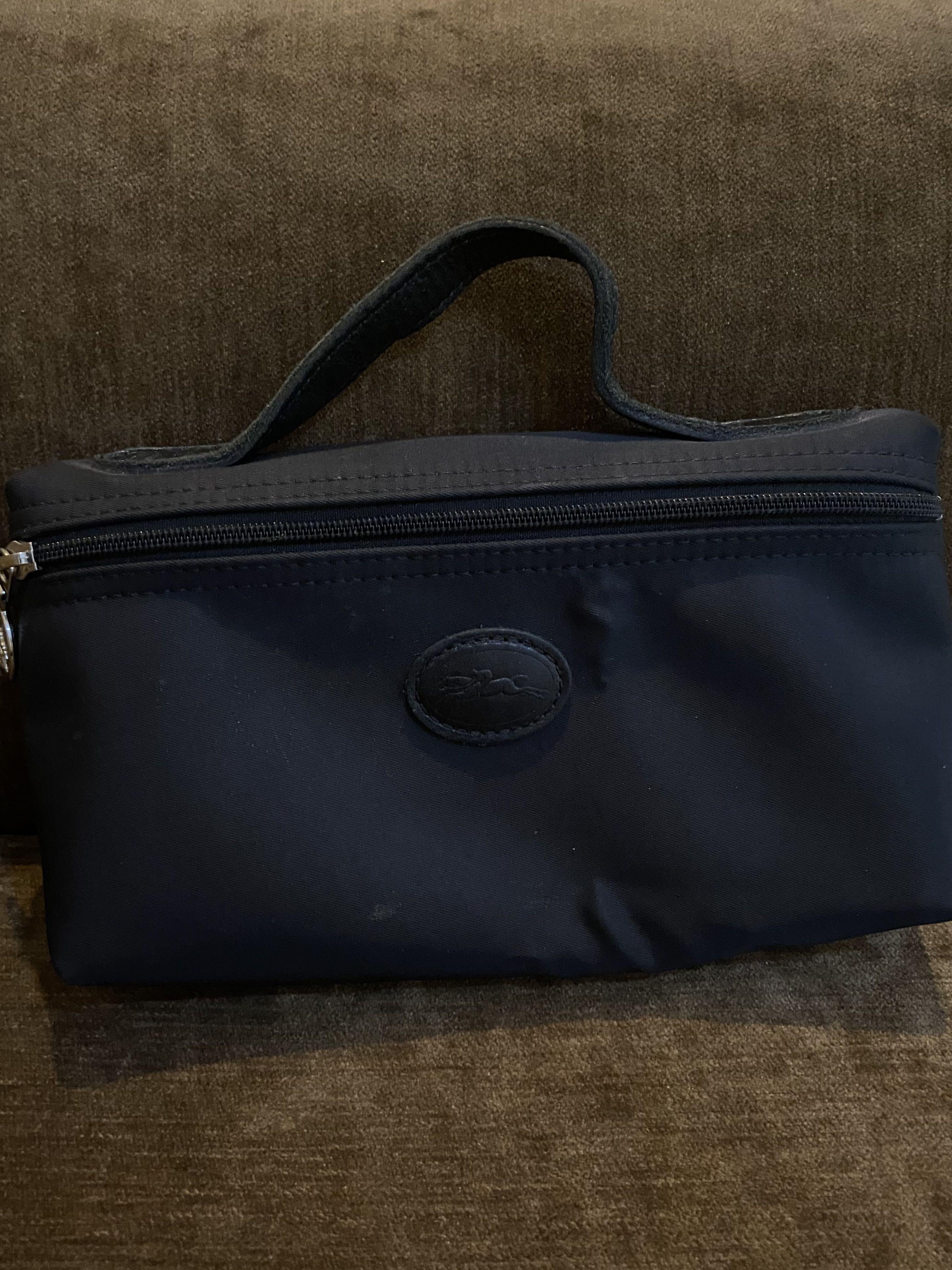 Harga pouch longchamp original hotsell
