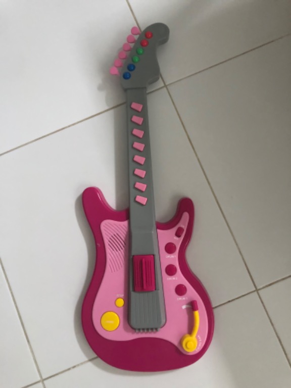 Plastic toy guitar, Hobbies & Toys, Toys & Games on Carousell