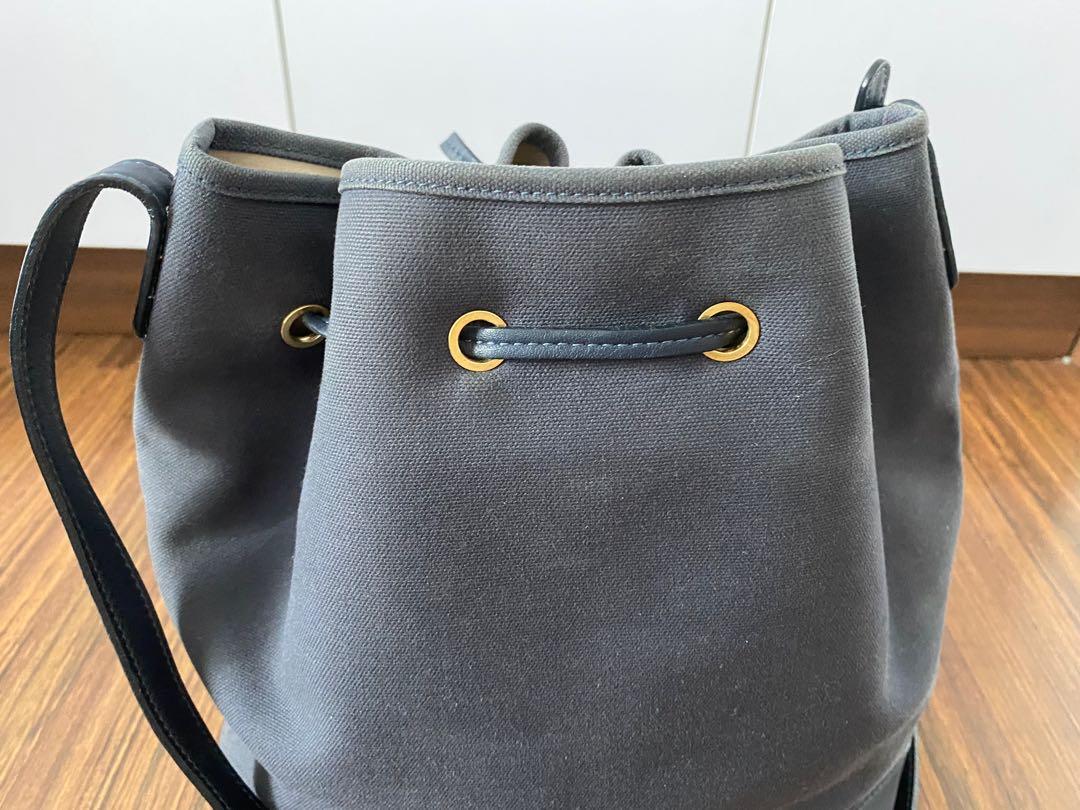 Mansur Gavriel Bucket Bag, Authentic (Category: Luxury Bags & Wallets) located in Makati City. Submitted by love2give.ph (Listing ID 1150865033, Image 2). Description: Overall Condition: Good Exterior Condition: Good Interior Condition: Good Designer: Mansur Gavriel Material: Navy canvas and leather No inclusions Origin: Italy Measurements: 9" L x 6" W x 12" H Interior Pockets: Two flat pockets Handles: Single flat leather adjustable shoulder str