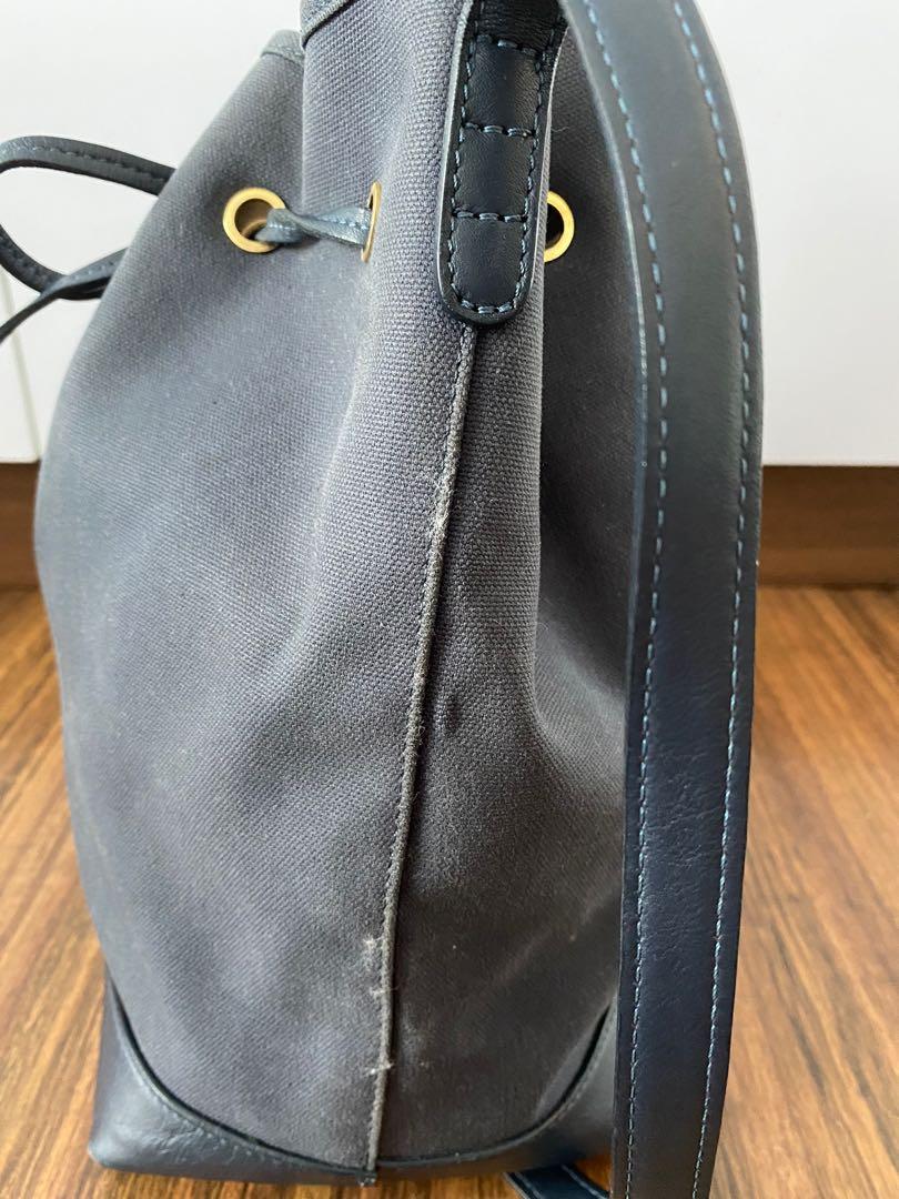Mansur Gavriel Bucket Bag, Authentic (Category: Luxury Bags & Wallets) located in Makati City. Submitted by love2give.ph (Listing ID 1150865033, Image 3). Description: Overall Condition: Good Exterior Condition: Good Interior Condition: Good Designer: Mansur Gavriel Material: Navy canvas and leather No inclusions Origin: Italy Measurements: 9" L x 6" W x 12" H Interior Pockets: Two flat pockets Handles: Single flat leather adjustable shoulder str