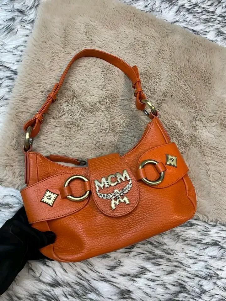 Mcm orange pochette (Category: Luxury Bags & Wallets) located in Butuan. Submitted by jen_pre (Listing ID 1150907021, Image 1). Description: .