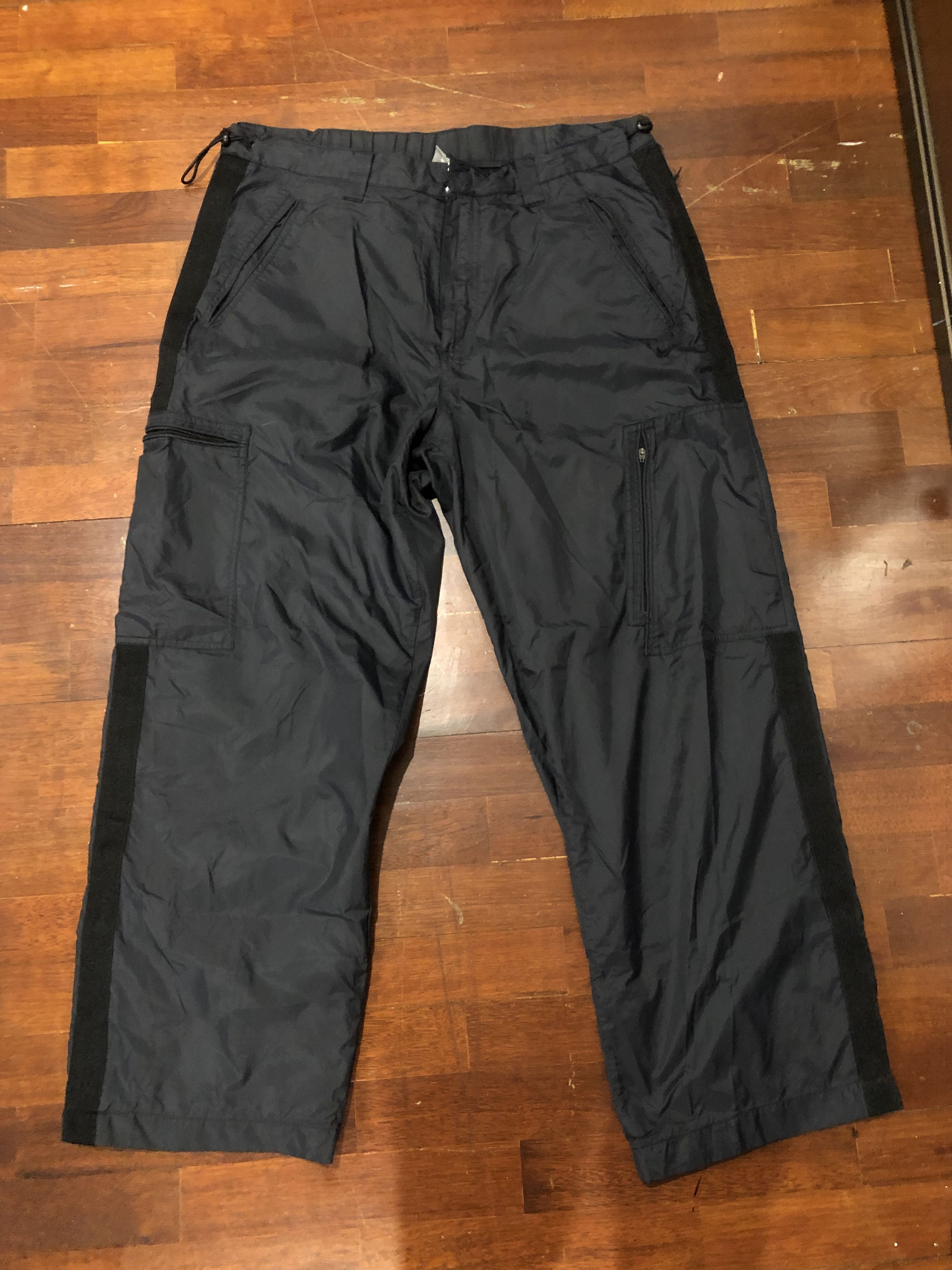 Nike black windbreaker pants hot sale