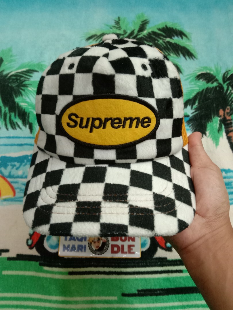 Supreme topi top